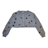 Artigli knitted cropped cardigan, size 3Y. The cardigan is grey with red and black knitted pois, glittery buttons, and long sleeves.