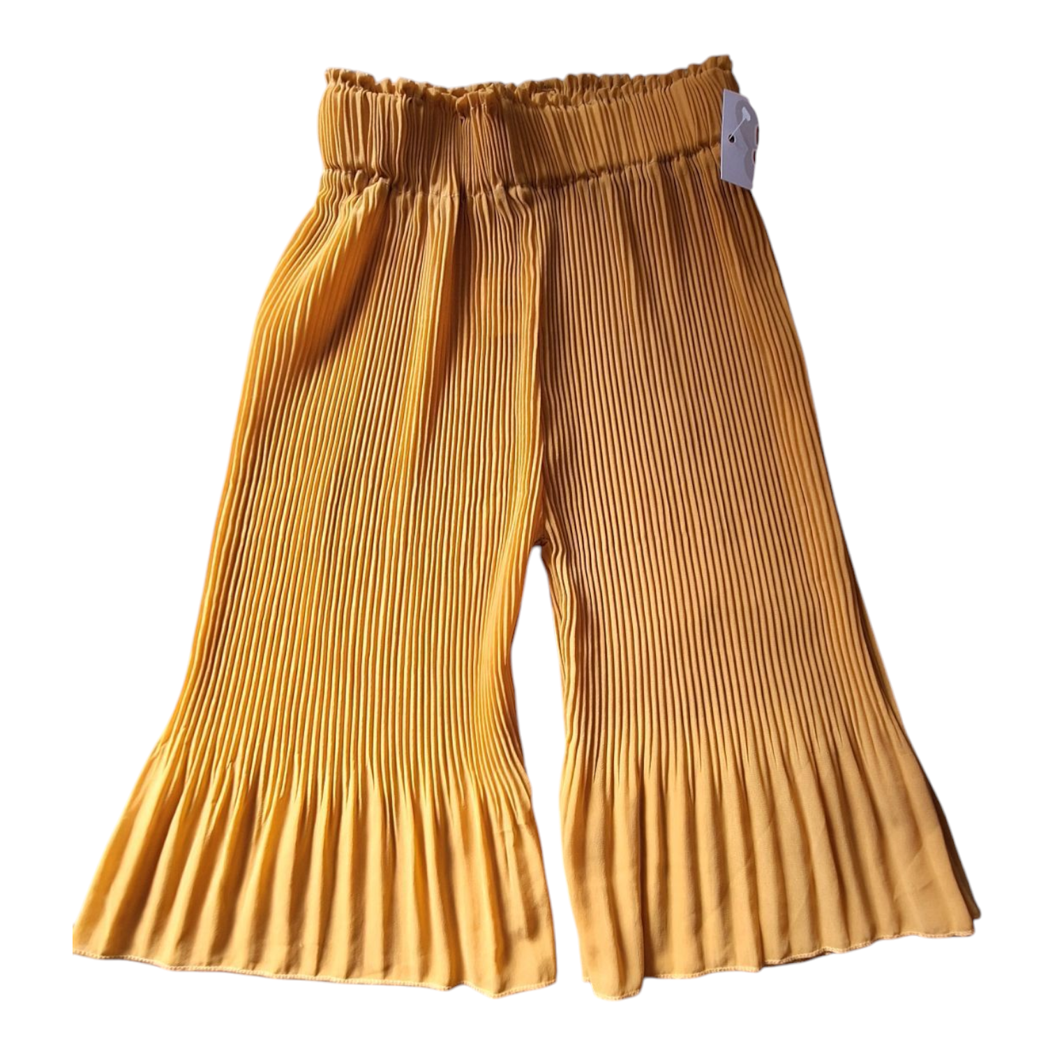 Pleated flowy yellow pants, size 104cm. The pants are mustard yellow with an elastic waistband and pleated details at the hem.