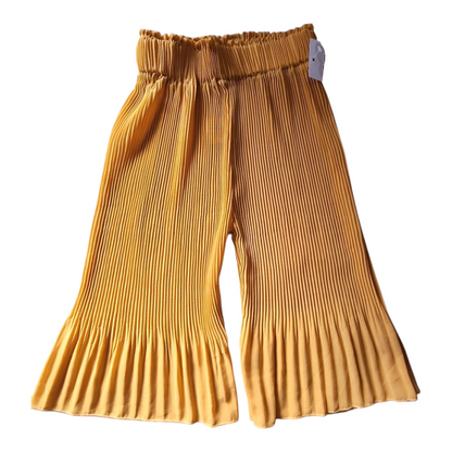 Pleated flowy yellow pants, size 104cm. The pants are mustard yellow with an elastic waistband and pleated details at the hem.