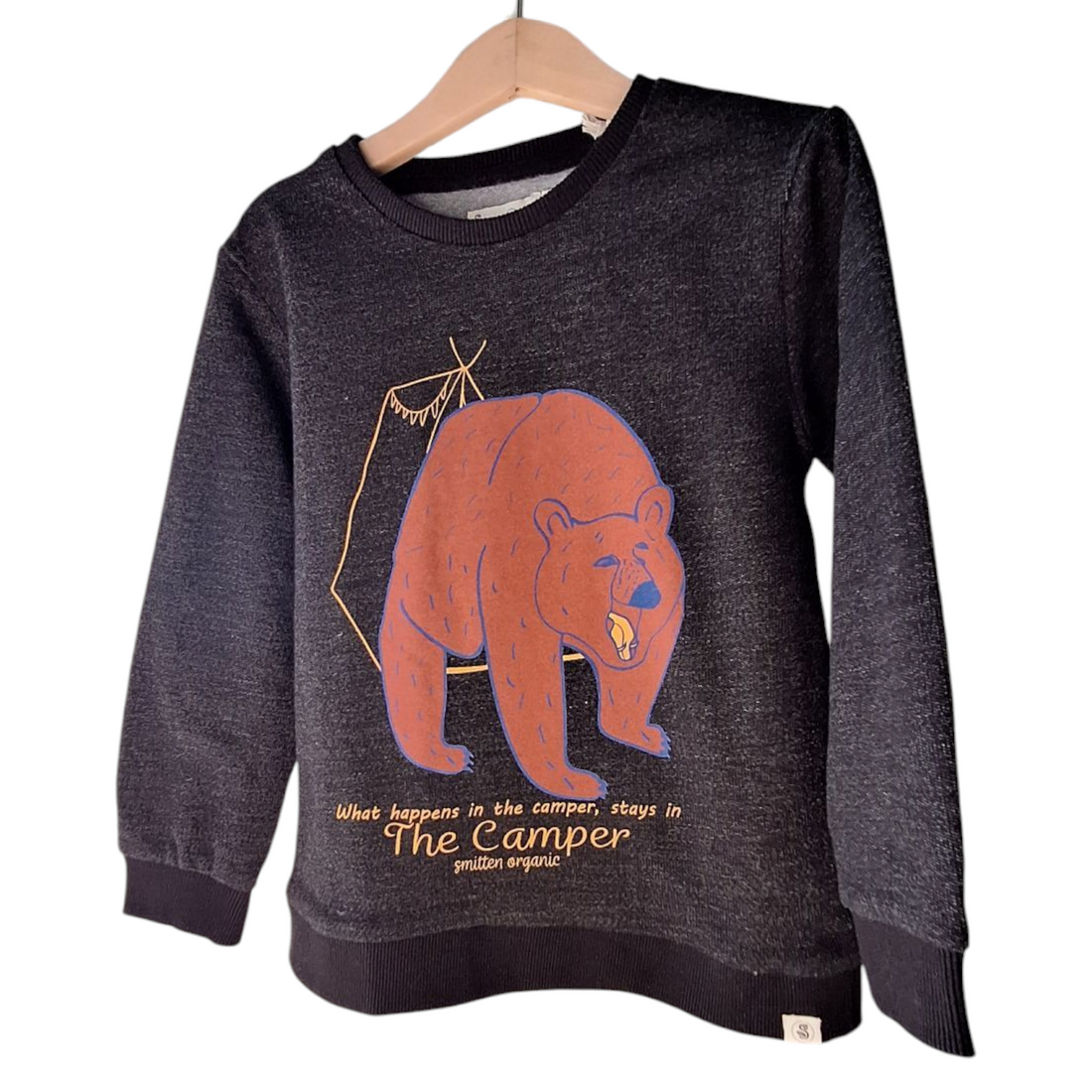 Smitten Organic fleeced sweater, size 110-116cm. The sweater is black melange with a brown bear design on the front, ribbed hems and cuffs, and long sleeves. The text &quot;The Camper&quot; is visible below the bear design.